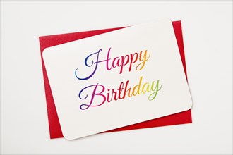 Colorful Happy Birthday card on red envelope
