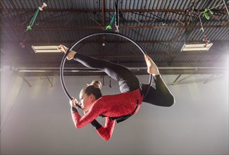 Teenage girl (14-15) practicing aerial dancing