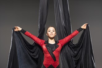 Teenage girl (14-15) performing aerial silk