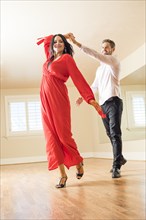 Couple dancing in empty apartment