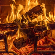 Close-up of fireplace burning wood