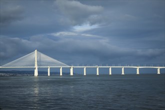Vasco de Gama bridge under cloudy sky