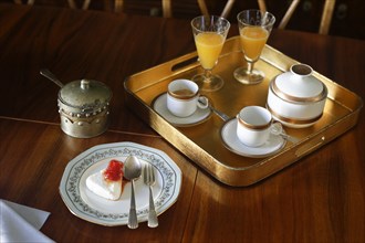 Antique tray with coffee and orange juice
