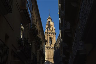 Church bell tower and old town buildings