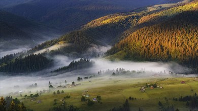 Foggy rolling landscape in Carpathian Mountains at sunset