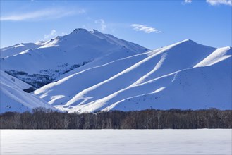 Winter landscape with snowy mountains