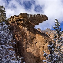 Rock formation with icicles hanging from edge