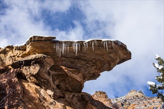 Icicles hanging from rock in mountains