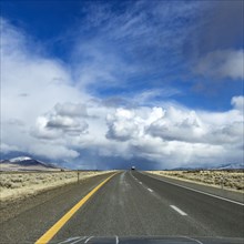 Winnemucca, Highway leading towards white clouds on horizon