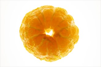 Peeled orange on white background