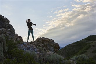 Mid adult woman hiking in mountains