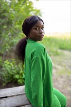 Woman wearing green blouse