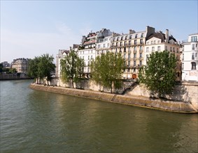Townhouses along river in city