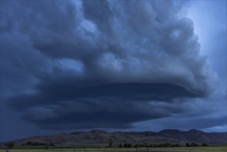 Arcus cumulonimbus storm clouds rolling across farmland