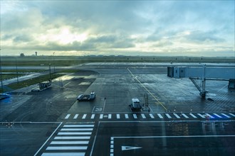 Empty airport tarmac on rainy day