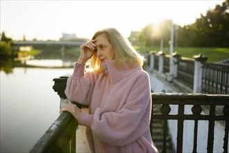 Side view of mature woman looking at river