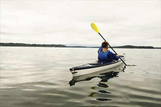 Man kayaking on lake