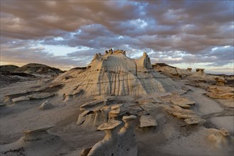 Usa, New Mexico, Bisti Wilderness, Clouds over badlands rock formations in Bisti/De-Na-Zin