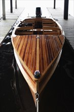 Wooden motorboat at pier