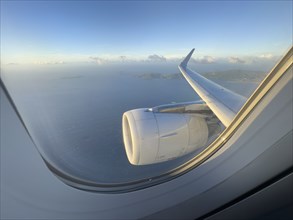 USA, United States Virgin Islands, St. Thomas, Airplane engine and Caribbean Sea seen through jet