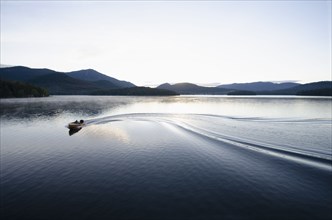 Boating at dawn on Lake Placid Lake, North Elba, New York, USA