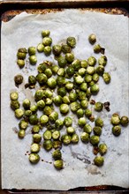 Overhead view of baked brussel sprouts on baking paper