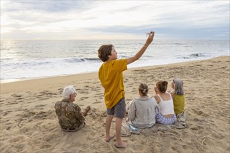 Mexico, Baja, Pescadero, Three generation family on beach