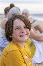Mexico, Baja, Pescadero, Portrait of smiling boy on beach