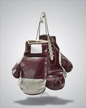 Studio shot of pair of old boxing gloves