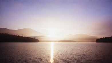 Sunrise over calm Lake Placid