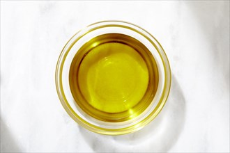 Overhead view of bowl of olive oil