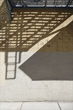 Shadows on concrete and brick wall