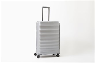 Studio shot of silver rolling suitcase