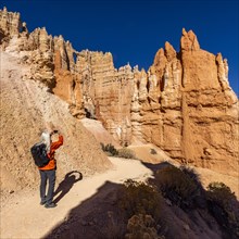 Rear view of woman taking pictures in Bryce Canyon National Park