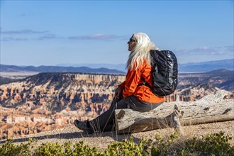 Senior woman with backpack looking at view in Bryce Canyon National Park