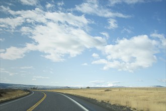 Highway 95 crossing grassy field, , Idaho, USA