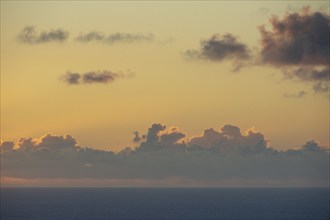 Clouds above calm ocean at sunrise, St. John, United States Virgin Islands, USA