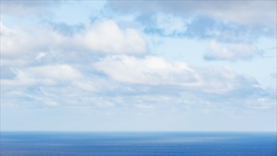 White puffy clouds above calm sea, St. John, United States Virgin Islands, USA