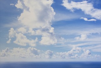 White puffy clouds above calm sea, St. John, United States Virgin Islands, USA