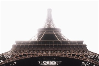 Low angle view of Eiffel Tower in mist, Paris, , France