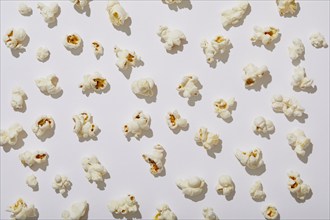 Overhead view of popcorn on white background, New York, NY, USA