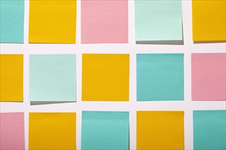 Rows of colorful blank adhesive notes on white background, New York, NY, USA