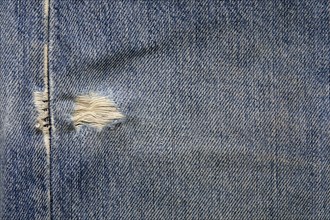 Close-up of worn jeans, New York, NY, USA