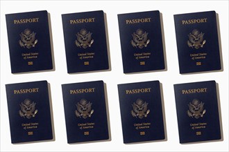 Rows of American passports on white background, New York, NY, USA