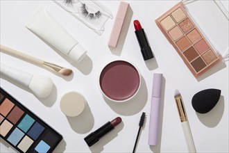 Overhead view of beauty and makeup products on white background, New York, NY, USA