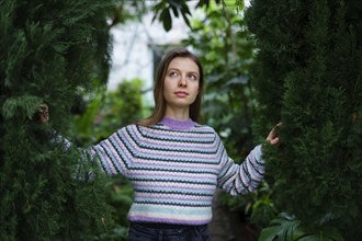 Portrait of woman standing in greenhouse, Omsk, , Russia