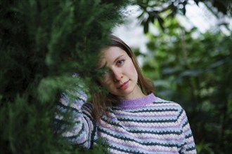 Portrait of woman standing in greenhouse, Omsk, , Russia