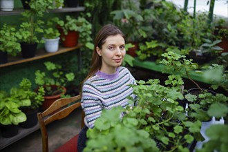 Portrait of woman standing in greenhouse, Omsk, , Russia