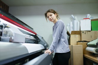 Portrait of woman working in printing studio, Omsk, , Russia