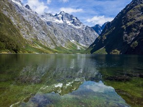 Calm lake and mountains in Fiordland National Park, Te Anau, Fiordland, New Zealand